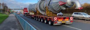 Abnormal load transport. Ballasted tractor using a drawbar and modular trailer